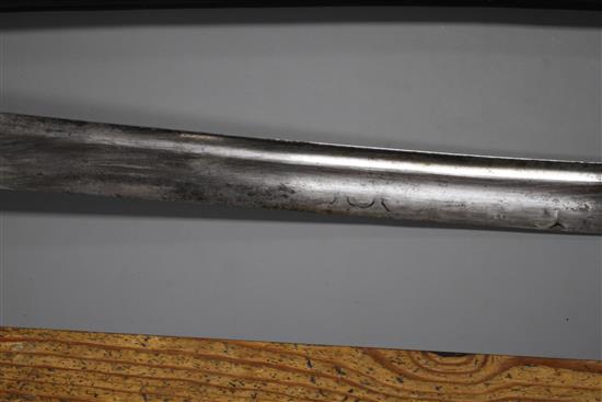 An Indian sword tulwar, silver decorated iron Lahori hilt, blade with etched inscription, 18th century, leather covered scabbard,
